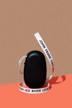 a ribbon of baby names rises around a label printer