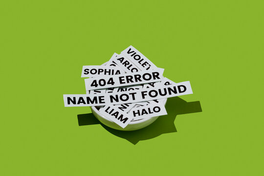 a bowl with baby name labels and a 404 error name not found message