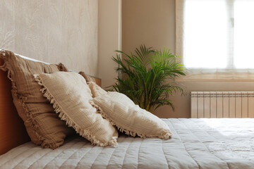 Cozy bedroom interior with soft decor and natural light