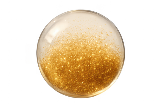 Golden glitter particles floating in transparent sphere
