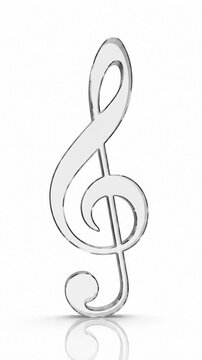 Clear Glass Treble Clef Rotating, Reflective Surface