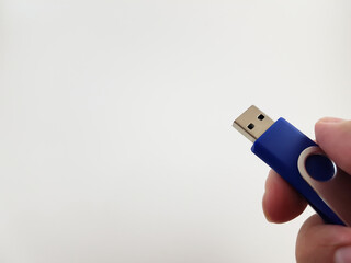 Blue Memory Stick in Hand Isolated Against Blank Backdrop Hand Holding Blue USB Flash Drive on White Background