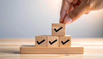Hand Placing Wooden Block with Checkmark Completing Row