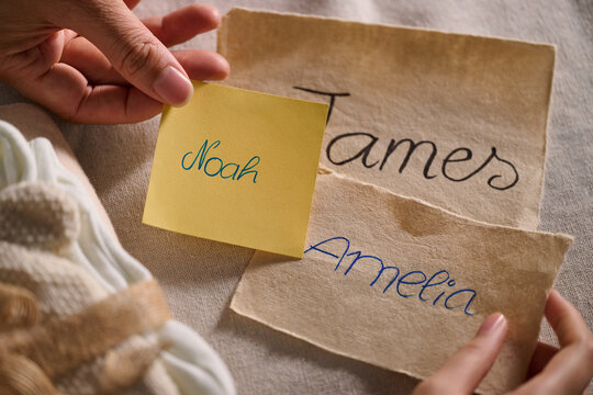Names written on paper with a sticky note