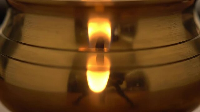 Candle Flame Reflection in Brass Bowl