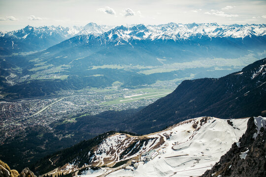 Snow-covered mountains overlook a beautiful valley