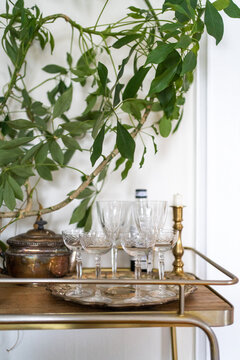 Vintage bar cart with glassware and decor
