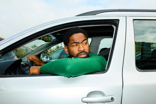 Driver looks around from his car