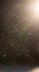 Obraz premium Numerous illuminated particles float suspended against a dark background with bright light emanating from the upper right corner.