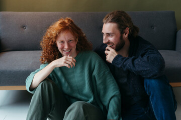Joyful Moments Shared Between Friends in Cozy Living Room