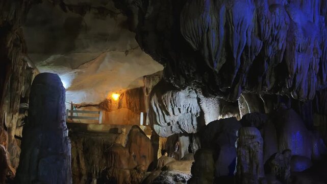 Wang Vieng, Laos.Tham Jang Cave-stalactites and stalagmites in a karst mountain with a Buddha temple inside. There is a spring inside the cave. The cave is equipped with comfortable paths and lanterns