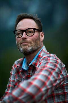Man in a plaid shirt looking at the camera