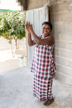 African woman clapping hands expressing joy in Senegal