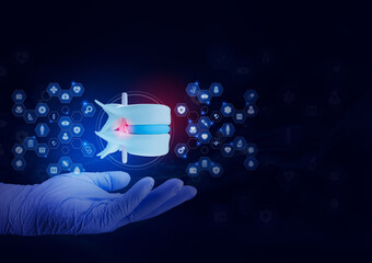 An orthopedic specialist's hand examines a model of a lumbar disc herniation. Concept of spinal diagnosis, nerve compression assessment, and lumbar health on a black background.