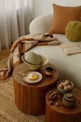 Close-up of cozy interior details – tea set, dessert and natural textures on a wooden table....