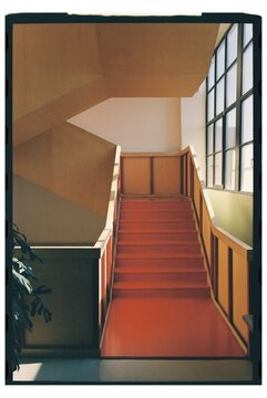 Staircase in a bright, minimalist building with smooth surfaces