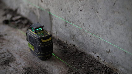 Laser level tool at construction site
