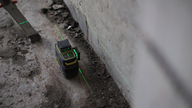 Laser level alignment during wall construction