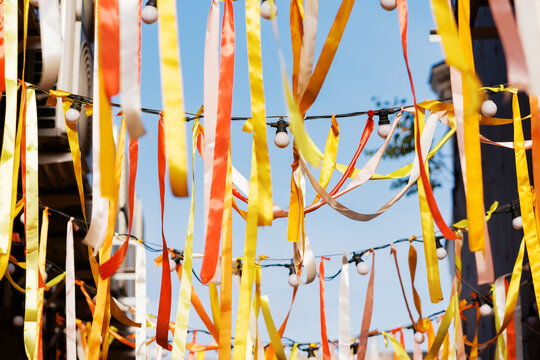 Colorful Ribbons Sway at a Festive Outdoor Celebration