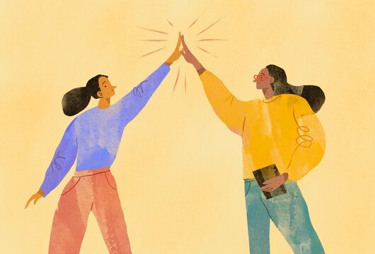 women clapping hands with each other