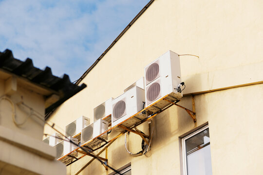 Commercial Air Conditioning Units Mounted on Building Wall