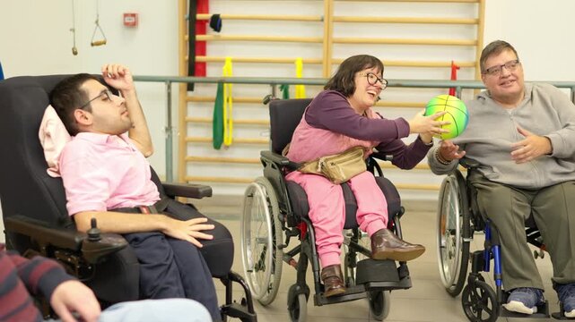 People with physical disabilities playing with a ball