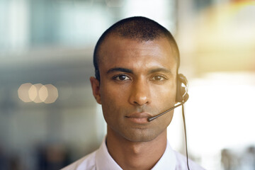 Agent portrait, man and headset in call center for customer support, help desk and contact us....