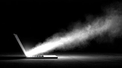 Rocket launching from laptop for startup success concept. A laptop emitting light and smoke in a dark environment.