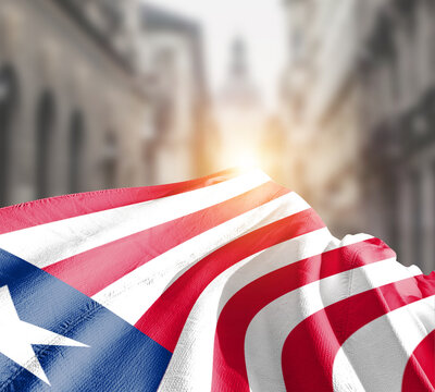 Liberia flag fluttering on blur street with building. Liberia national flag for independence day.
