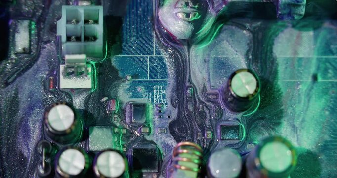 Neon paint pour. Digital hardware. Blur purple blue color sparkling liquid round microchip glitter texture leak on abstract background.