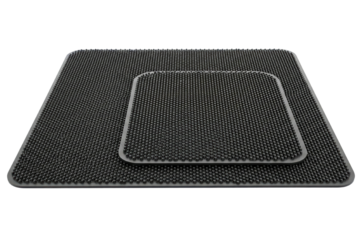 Square black silicone drying mat with textured raised dotted surface on isolated background