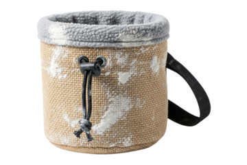 Beige rock climbing chalk bag covered in white magnesium powder dust on isolated background