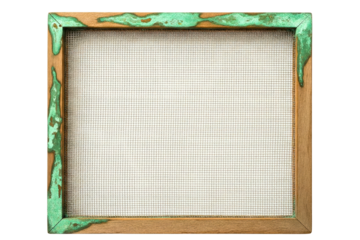 Old wooden frame with metal wire mesh and green dripping paint stains on isolated background
