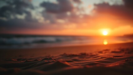 Obraz premium Serene beach sunset with golden tones and a softly focused horizon, creating a peaceful atmosphere.