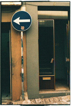 Blue One-Way Arrow Sign at Doorway Madeira 