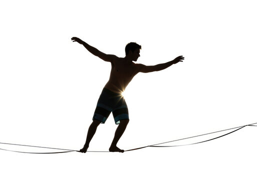 Person Balancing on Tightrope in Outdoor Setting.