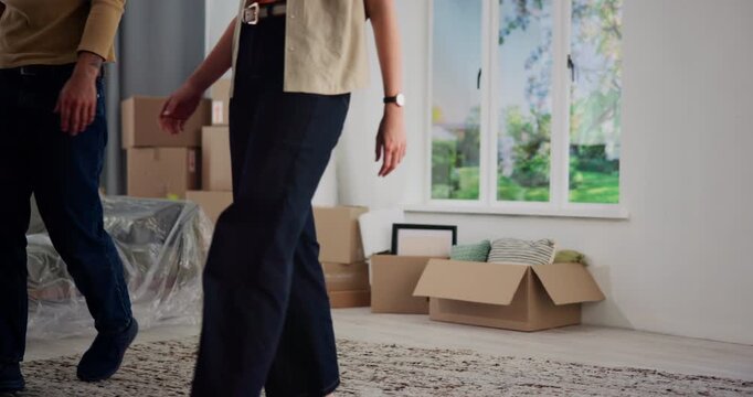 Couple, rolling carpet and excited in new home, moving and interior design for flooring with real estate. Man, woman and helping hand with partner, mat and boxes at apartment, relocation and property