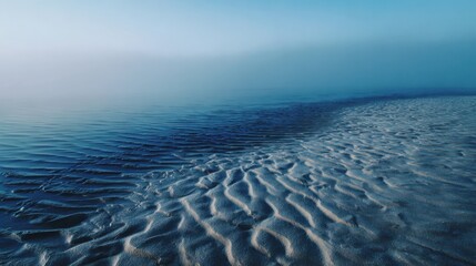 Foggy Shoreline with Rippled Sand and Calm Water beach ripples