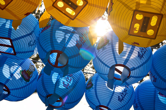 Colorful Lanterns Decorating a Clear Bright Blue Sky.