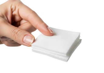 Closeup of a persons hand holding a small stack of white square cotton pads isolated on transparent background