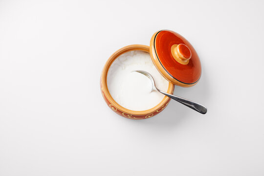Homemade yogurt in a ceramic bowl. Light background.