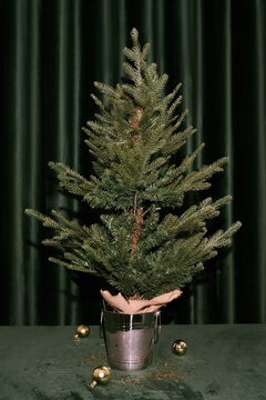 Mini Christmas tree in metal bucket with ornaments
