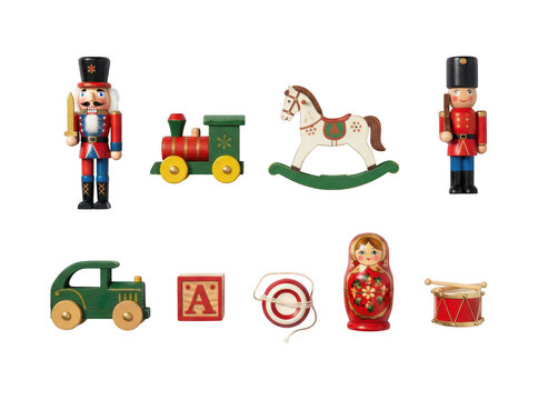 Collection of traditional wooden toys including nutcracker soldier, train, rocking horse, car, block, target, matryoshka doll, and drum isolated on transparent background