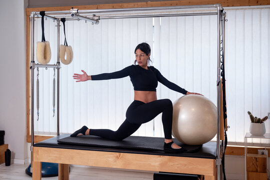 Pregnant Woman Rotating Torso In Pilates Lunge