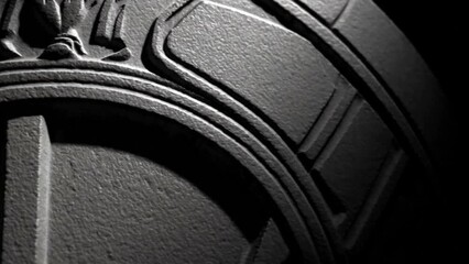  National emblem close-up carved into stone, dramatic shadows

