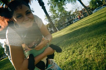 teen hugging pet dog
