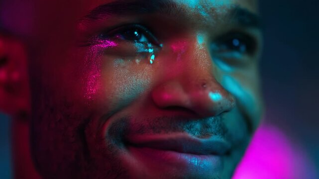 A profound emotional moment captured in vibrant colors, showcasing the beauty of vulnerability and expression, revealing a mix of joy and introspection through the tears of a smiling individual.