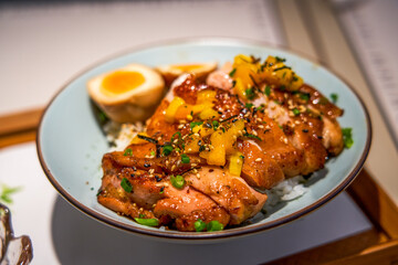 A bowl of delicious and fragrant Japanese teriyaki chicken leg rice