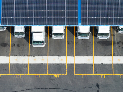Delivery Trucks Under Solar Panel Canopy