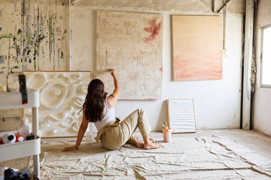 Artist creates abstract works in a bright studio space